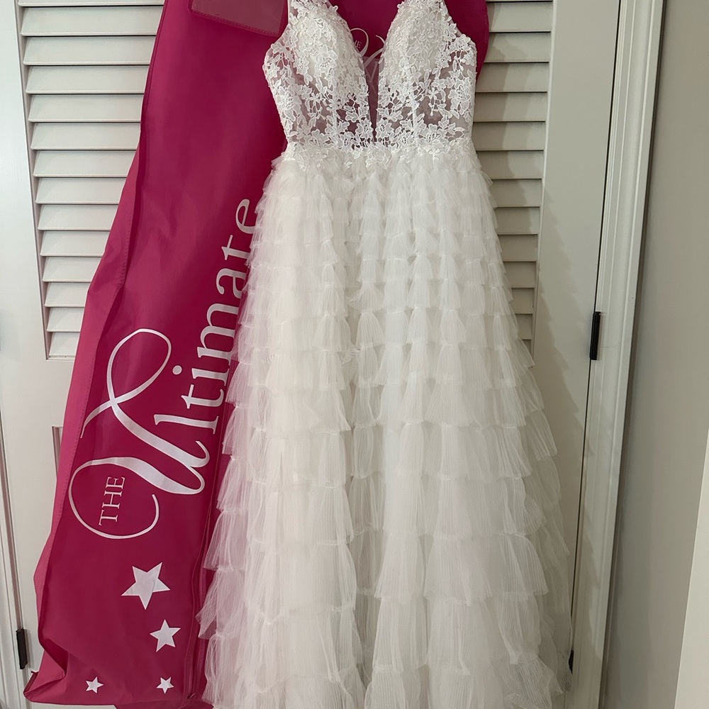 Nina Canacci #3226. Ivory prom dress. Altered to Size 4. Bought for $600.